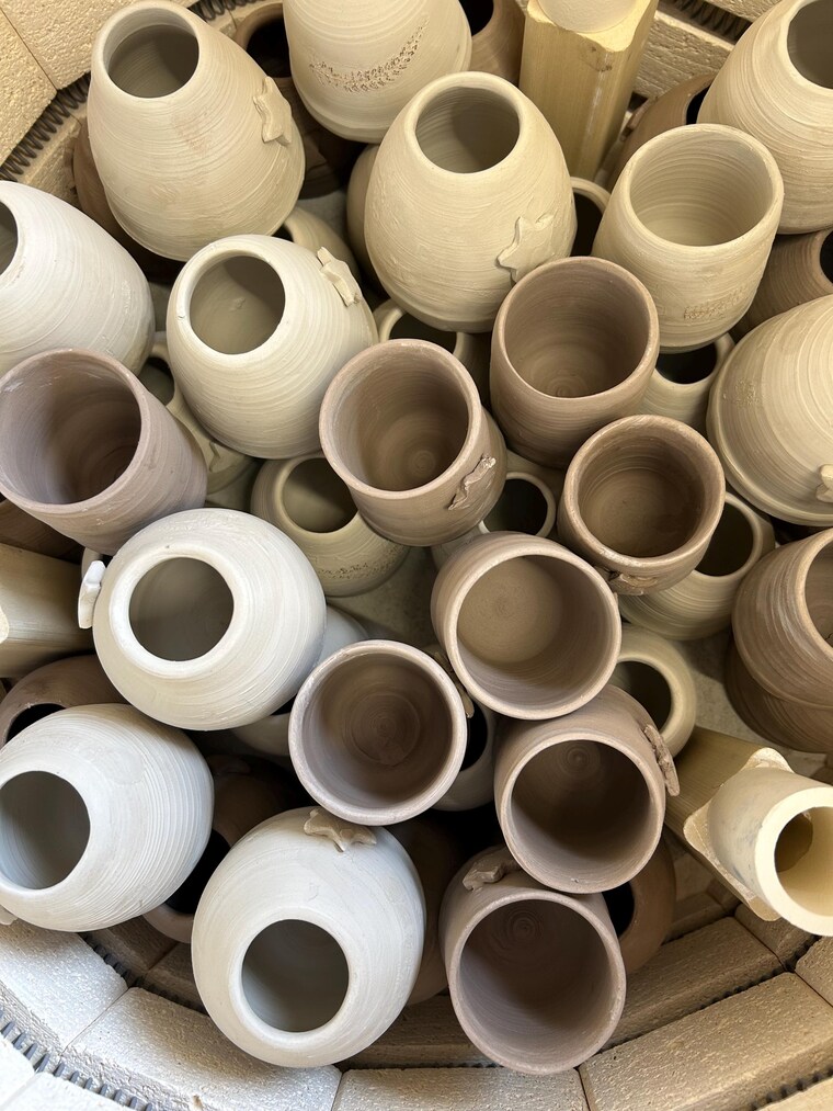 Sally's kiln, loaded with unfired mugs and vases
